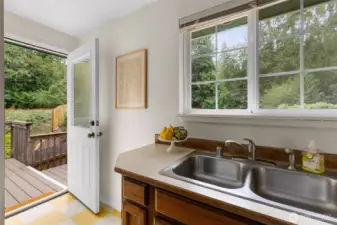 Kitchen opens to a secluded back deck.