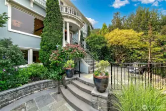 A gentle approach from East Crescent Drive leads to bluestone patios and established gardens.