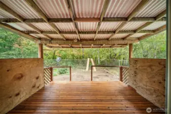 Covered back deck for year round outdoor living space.