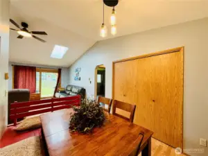 Dining area with built in bench with storage, full wall pantry, LVP, vaulted ceilings