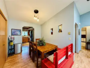 Dining area with built in bench with storage, full wall pantry, LVP, vaulted ceilings