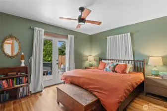 The primary bedroom has that perfectly cozy feel with the original hardwood floors and the double french doors opening out to your own private oasis.