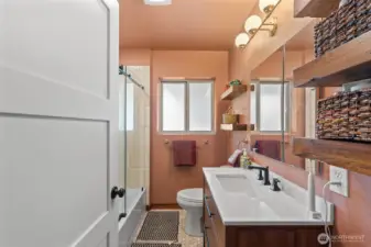 Enjoying this fully updated bathroom with gorgeous tile and lighting giving the modern feel of todays times.