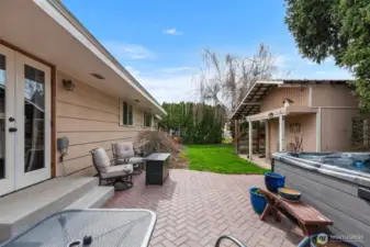 The fully fenced back yard is fully landscaped with a garden shed for all of your gardening needs