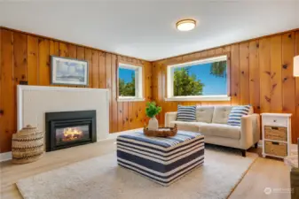 4th (primary) bedroom located downstairs with gas fireplace. You could also use this room as your second, informal living space. Big views of the water, well cared for knotty pine siding.
