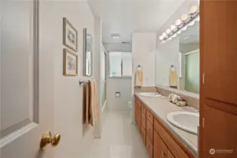 Full size main bathroom features dual sinks and great storage.