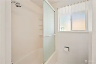 Glass enclosure for the bathtub/shower.
