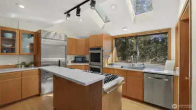 Modern kitchen featuring a sleek countertop with a built-in stove, combining style and functionality.