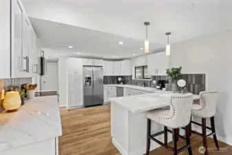 The perfect selection of quartz counter tops and stylish deco tile backsplash. Pendant lighting and an abundance of soft closing cabinetry.