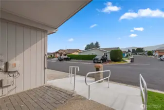Covered Front Entry with Concrete Ramps and Hand Railings