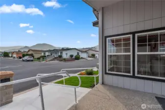 Covered Front Entry with Concrete Ramps and Hand Railings