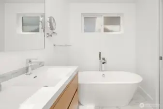 Primary bathroom w/ standalone tub in