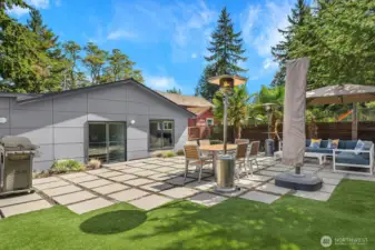 Backyard w/ a seating and dining area