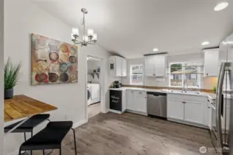 Kitchen with bar and table area.