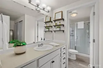 Primary retreat with 3/4 bath en suite.