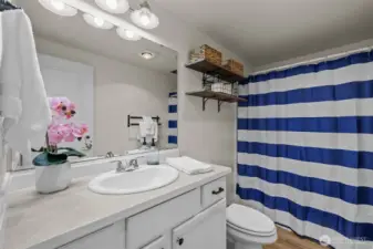 Two bedrooms share this full bathroom.