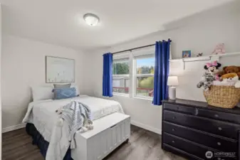 Third bedroom with vinyl plank flooring.