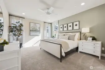 Primary bedroom. Photo is of the model, colors and finishes may vary.