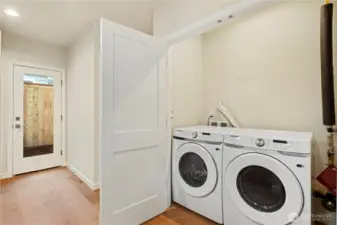 Full size washer and dryer on main with plenty of room for storage options above.