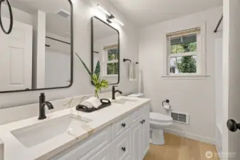 2nd bathroom with dbl sinks and full bathtub / shower