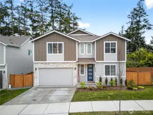 Beautifully maintained two-story home with modern curb appeal, stone accents, and a welcoming front entry, located in a quiet neighborhood with a fully fenced yard and attached two-car garage.