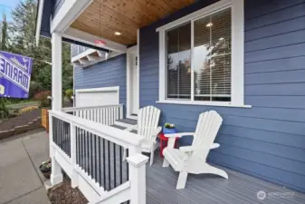 Covered front patio to welcome guest or enjoy peekaboo views of the Sound and neighborhood.