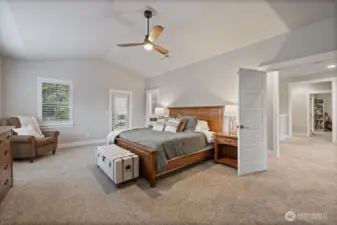 Grand entrance to the spacious and light Primary suite with ceiling fan, 2 walk in closets