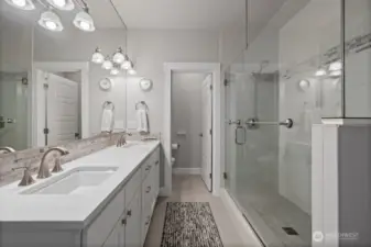 Double sinks, large walk-in shower, private commode