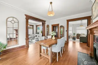Dining room with fire place and original sliding doors.