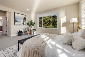 Welcome to your primary suite with large windows to bring your outdoor oasis inside! Views of your private greenbelt.