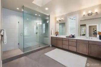 Beautifully designed spa like bathroom in primary bedroom!