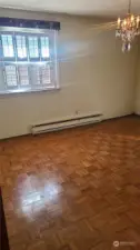 Primary bedroom main floor facing front of house