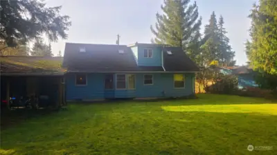 Rear of house with covered patio off of garage