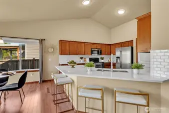 Ample diniNew quartz countertops in bathrooms & kitchenng area