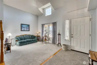 Enter from the covered porch into a large entry and formal living room.
