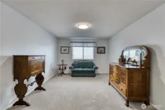 This room would traditionally be the dining room located right off the kitchen area.