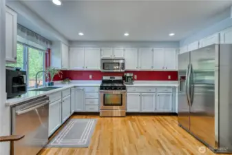 Spacious kitchen with lots of cabinets and counter space makes entertaining a breeze.