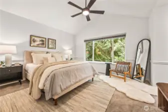 Primary suite with vaulted ceilings, walk-in closet, and 5-piece ensuite bath.