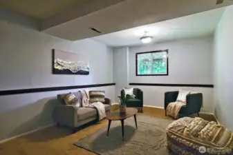 On lower level, there is a nice family room type space.