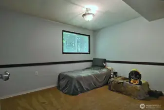 Also on the lower level is an extra room currently used as a bedroom.