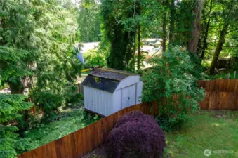 The storage shed is outside the fence, but part of the property,