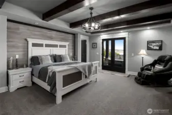 Primary room on main floor of home with french doors to outside hot tub!
