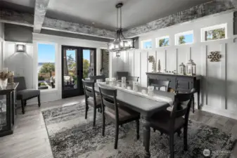 Dining area with doors that open to outdoor covered living space.