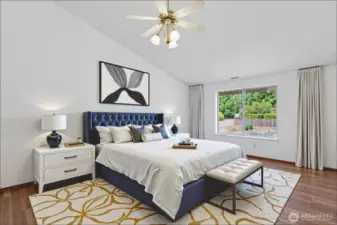 Main bedroom with vaulted ceiling virtually staged