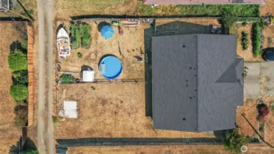 Each unit has a sizable yard. Aerial view shows the street frontage as well as an alleyway access by the backyards.