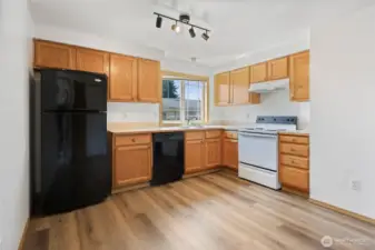 Kitchen has some updated appliance with eat-in dining space.