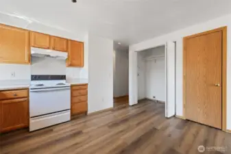 Adjacent to the kitchen is your laundry closet. Door to the right goes to the 1 car garage.