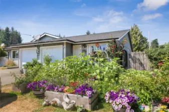 Tenant has added many raised beds for her own garden space.