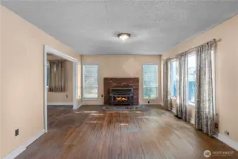 The wood fireplace insert is great to keep you warm in the winter. Fire is digitally staged, buyer to confirm functionality.
