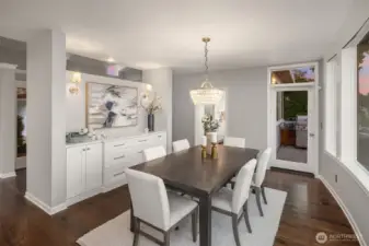The formal dining room is the heart of the home.  From here you can connect with the living room, kitchen and 2 outdoor decks.  The built ins were added to provide storage but also to ground this space with the new kitchen.